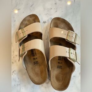Birkenstock Nude Patent Sandals with Gold Buckles